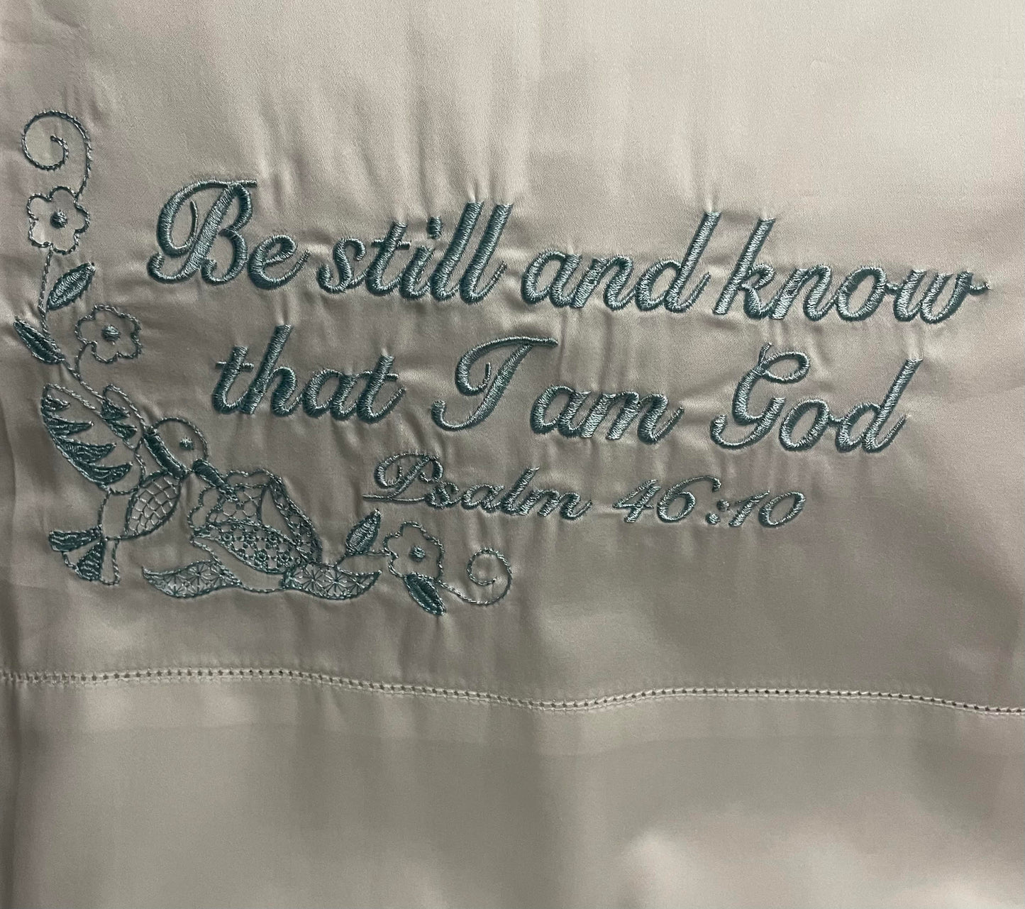 Pillowcase embroidered with "be still and know that i am god"