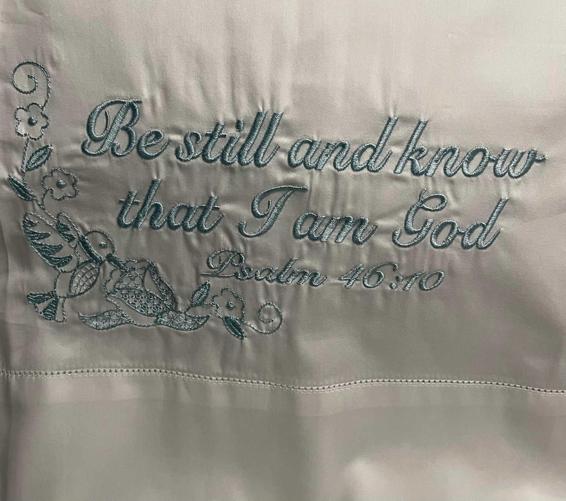 Pillowcase embroidered with "be still and know that i am god"
