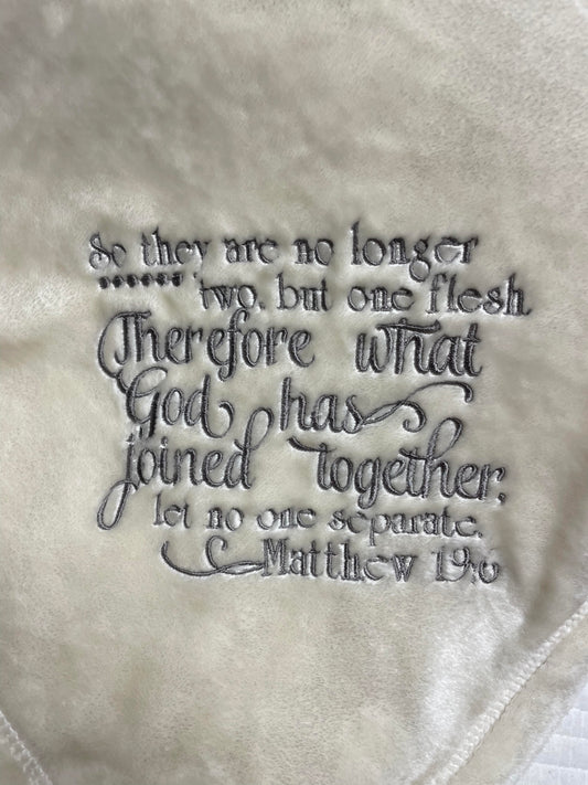 Blanket embroidered with the verse Matthew 19:6